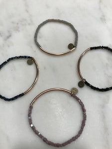 Four piece bracelet stack set with rose gold bar