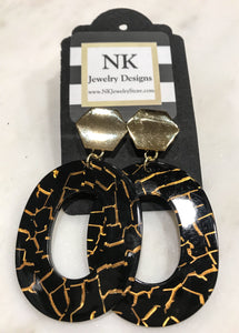 Large gold and black oval earrings