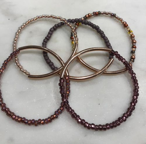 Five piece stack seed bead rose gold/purple set